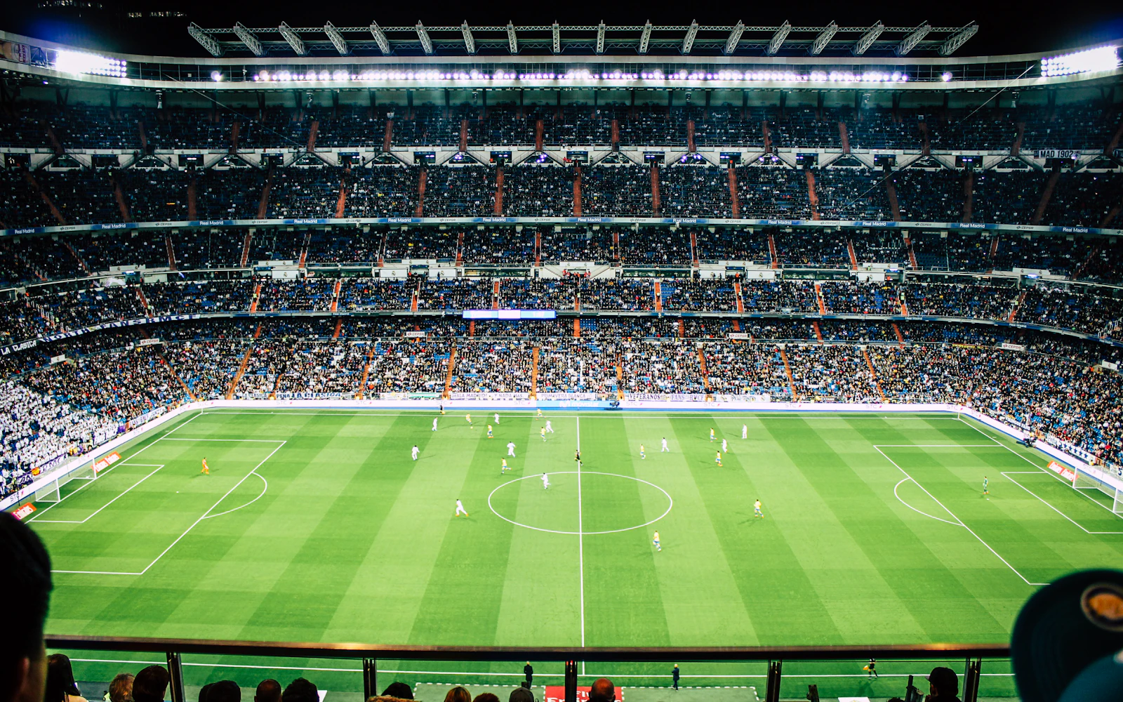 Football stadium under floodlights