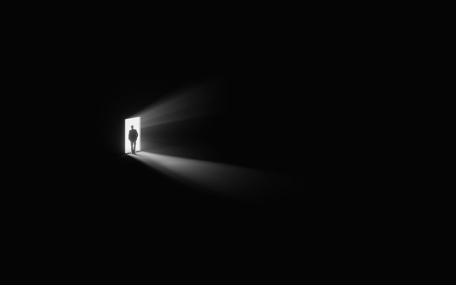 An open doorway leading into daylight